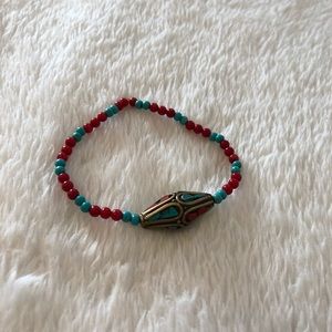 Brass wintag braclate with turquoise